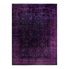 a purple rug with an intricate design on the front and back side, in various colors