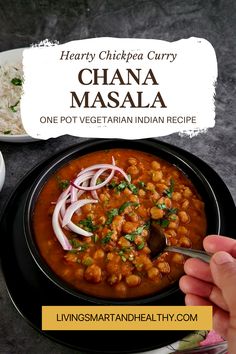 hearty chickpea curry with masala in a black bowl on a table