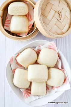 some food that is on a white plate and in a wooden basket next to it