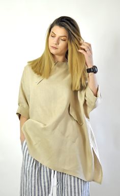 "Linen Shirt, Women Shirt, Beige Shirt Linen Top. Woman exstravgant loose shirt. Handmade linen shirt. Beautiful and comfortable. Linen Summer Blouse. Comfortable top. Asymmetric Loose shirt. Excellent style for a spring and summer seasons. ◾Quality NATURAL linen fabric. Color :Beige Model wearring size S. Fabric: 100% Linen ◾ The style was originally designed and professionally constructed by me. Each item of my shop is specially packaged with a lot of concern! Handmade in a pet-free and smoke- Spring Lagenlook Blouse With Batwing Sleeves, Oversized Tops With Pockets And 3/4 Sleeves, Beige Linen Lagenlook Top, Casual Oversized Tunic Top, Casual Beige Tunic Top, Oversized Linen Collared Blouse, Relaxed Fit Tunic Top In Lagenlook Style, Oversized Spring Tunic Tops, Relaxed Fit Lagenlook Tunic Top