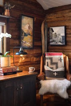 a chair and table in a room with wooden walls