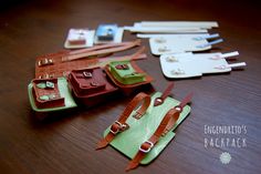 several pieces of leather sitting on top of a wooden table