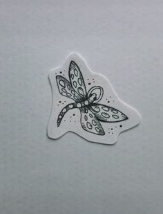 a sticker with a dragonfly design on it's back and the bottom part of its wing