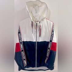 Nwot Tommy Hilfiger Hooded Windbreaker Yacht Jacket Red-Blue Women’s Size M - Excellent Condition - New Without Tags - Material 100% Polyester - This Is A Classic Tommy Hilfiger Style And Looks Super Stylish On Tommy Hilfiger Hooded Outerwear For Streetwear, Tommy Hilfiger Casual Hooded Windbreaker, Tommy Hilfiger Hooded Streetwear Outerwear, Casual Hooded Tommy Hilfiger Windbreaker, Hooded Tommy Hilfiger Outerwear For Streetwear, Hooded Red Tommy Hilfiger Outerwear, White Hooded Tommy Hilfiger Hoodie, Trendy White Hooded Jacket With Drawstring, Trendy White Outdoor Outerwear