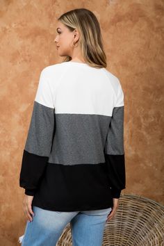 ROUND NECK, PUFF SLEEVE, COLOR BLOCK TOP COLOR: IVORY-2TONE CHARCOAL-BLACK Fabric Content: 95% Polyester, 5% Spandex SIZES BUST WAIST HIPS XS 0 31 23 33 1 32 24 34 S 3 33-34 25 35-36 5 34-35 26 36-37 M 7 36-37 27 37-38 9 37-38 28 38-39 L 11 39-40 29-30 39-40 13 40-41 31-32 41-42 XL/1X 14 42-43 33-34 43-44 16 43-44 35-36 44-45 2X 18 45-46 37-38 45-46 20 46-47 39-40 46-47 3X 22 48-49 41-42 48-49 24 49-50 43-44 50-51 Black Tops With Contrast Color For Layering, Casual Tops With Contrast Panels For Layering, Casual Top With Contrast Panels For Layering, Black Long Sleeve Tops With Color Matching, Loungewear Tops With Contrast Color Crew Neck, White Contrast Color Top For Loungewear, Contrast Color Block Long Sleeve Tops, White Tops With Contrast Color For Loungewear, Sporty Contrast Color Tops For Fall