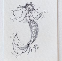 a drawing of a mermaid holding a fish