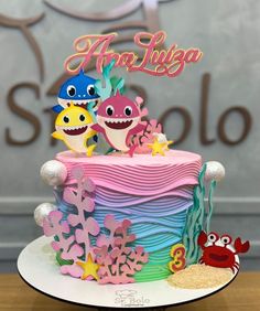 there is a cake that has been decorated with different types of sea animals on it