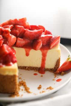 a cheesecake with strawberries is on a plate