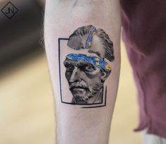 an old man with a blue bandanna on his head is depicted in this portrait tattoo