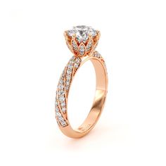 a rose gold engagement ring with diamonds on it