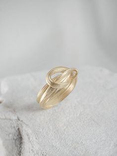 "A Perfect ring for an engagement & wedding or even as an elegant layer for an everyday ring mix. This is a truly unique piece, filled with elegance and charm and \"movement\". It is bound to become a cherished gift for your loved one. > 14K or 9K solid gold, also available in Goldplated Silver. > Can be made in yellow, white and rose 9k or 14k solid gold. Please choose a material > Ring width:approximately 4 mm > Handmade in Greece For additional sizes (also for quarter and half Modern Twist Ring Jewelry Gift, Modern Twist Ring Jewelry As Gift, Elegant Stackable Rings In Recycled Gold As A Gift, Modern Sterling Silver Bypass Ring For Wedding, Modern Sterling Silver Bypass Wedding Ring, Modern Twist Jewelry With Ring Detail Gift, Stackable Fine Jewelry Bypass Ring For Wedding, Modern Twist Jewelry With Ring Detail As Gift, Modern Jewelry With Ring Detail As A Gift