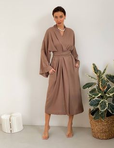 🌿Maxi linen wrap kimono dress with fabric belt. The belt fixes the waist well, and the pockets are made for your comfort and convenience. You can wear this stylish kimono at home or on the walk, apply kimono, as a cardigan, summer cloak. You will be delighted with this kimono dress in Bohemian style. MORE: https://www.etsy.com/shop/ArtVyshyvankaUA?ref=seller-platform-mcnav§ion_id=38397051 The height of the model on photo is 170 cm ( 5.7 ) Fabric: 100% linen ------------------------------------- Chic Belted Wrap Kimono, Chic Wrap Dress With Belted Kimono Sleeves, Chic Wrap Dress With Kimono Sleeves And Belt, Chic Belted Wrap Dress With Kimono Sleeves, Beige Wrap Dress With Tie Waist, Elegant Wrap Kimono With Belt, Elegant Belted Wrap Kimono, Elegant Linen Kimono With Kimono Sleeves, Spring Wrap Dress With Belted Kimono Sleeves