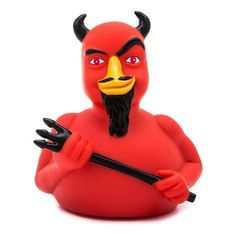 a red devil figurine with black horns and a mustache