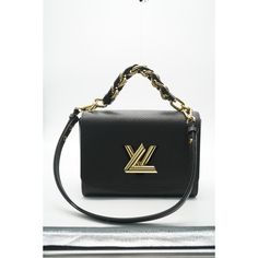 Listing Title: Louis Vuitton Black Epi Braided Handle Twist MM   SKU: 138115   Condition: Pre-owned    Handbag Condition: Excellent   Condition Comments: Item is in excellent condition and displays light signs of wear. Scratches to hardware.   Brand: Louis Vuitton   Model: Twist MM   Origin Country: France   Handbag Silhouette: Crossbody Bag;Shoulder Bag   Occasions: Evening;Everyday;Fall/Winter;Seasonal;Spring/Summer   Size (Generic): Medium   Size (Specific): Medium   Interior Material: Microfiber   Interior Color (Generic): Black   Handbag Closure Type: Turnlock   Handbag Accessories: Additional Strap;Dustbag;Mirror;Removable Straps   Hardware Material: Brass   Hardware Color: Gold-Tone   Exterior Color (Generic): Black   Exterior Material (Generic): Leather   Exterior Material (Specifi Louis Vuitton Twist Mm Black, Celine Shoulder Bag, Country France, Louis Vuitton Black, Black Handbag, Bag Ideas, Bottega Veneta Shoulder Bag, Vintage London, Orange Bag