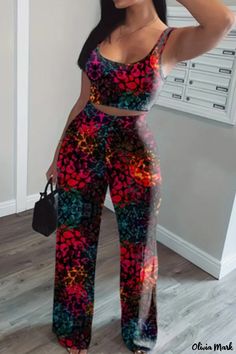 Olivia Mark - Contemporary Two-Piece Set: Printed Vest and Pants Ensemble with U-Neck and Sleeveless Design Casual Multicolor Two-piece Bottoms, Casual Sleeveless Printed Sets, Sleeveless Black Sets For Spring, Multicolor Sleeveless Two-piece Set, Sleeveless Multicolor Two-piece Set, Casual Multicolor Two-piece Pants Set, Multicolor Printed Sleeveless Sets, Casual Sleeveless Two-piece Jumpsuit, Casual Multicolor Printed Pant Set