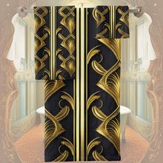 a black and gold shower curtain with an intricate design on the side, in front of a bathtub