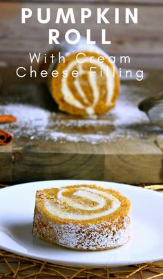 pumpkin roll with cream cheese filling on a white plate