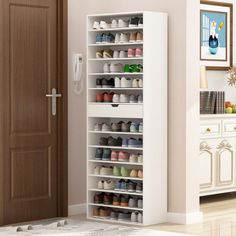 a white shoe rack with many pairs of shoes on it next to a door in a room