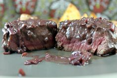 a close up of some meat on a plate