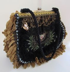 An exquisite needlepoint bag with heavy embellishments. Excellent clean condition inside & out. Ball snap closure. Clean gold ochre moire silk interior with side pockets. Each side is different. Black cord strap. Bee pin. Black rosettes, lace & crinkled ochre fringe. A true work of art. Paypal Payments Only Please! When auction concludes payments must be made within 3 days. Immediate Payment Appreciated. “Buy It Now” items must be paid immediately.  If you have a broken item or feel the item was Vintage Embellished Pouch Bag, Vintage Embroidered Tote Bag, Vintage Embellished Clutch Shoulder Bag, Vintage Black Embellished Bags, Vintage Embroidered Top Handle Shoulder Bag, Vintage Embroidered Top Handle Bag, Vintage Embellished Bag For Everyday Use, Vintage Embellished Rectangular Bag, Vintage Embellished Formal Shoulder Bag