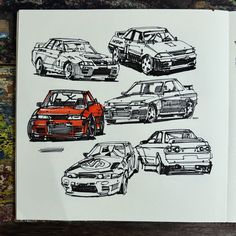 an open book with cars drawn on it