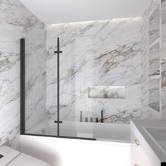 a white bathroom with marble walls and floor