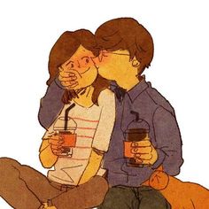 two people sitting next to each other with drinks in their hands and one person kissing the other