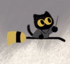 a black and yellow cat sitting on top of a tree branch with a stick in it's mouth