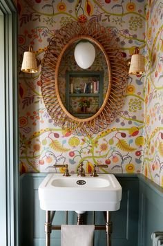 a sink and mirror in a small room