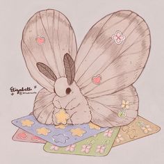 a drawing of a butterfly with its wings folded over it's head on some pillows