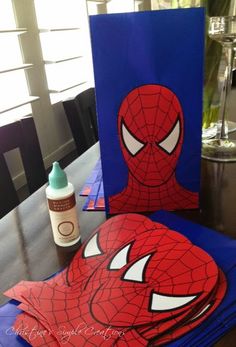 a spiderman themed birthday party with blue napkins