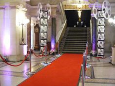 the stairs are decorated with black and white banners, lights, and decorations for an event