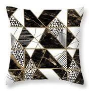 a black and white pillow with an abstract design