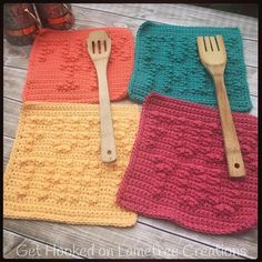 four crocheted placemats with wooden utensils on them, one in pink and one in yellow