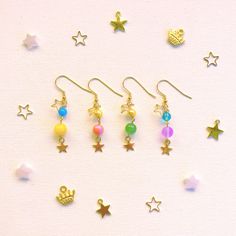 handmande earrings inspired by the group wonderlands x showtime from project sekai/colorful stage! a cute way to show off your favorite character in a subtle way ☆ rui's v1 earring pair will be sold at a discount until stock runs out! nothing's wrong with them i just like the other bead more :3 ☆INFO☆ - hooks are made of stainless steel - each pair is made to order! please allow me up to a week in order to make and ship out the order - earrings may have slight variation due to the nature of the Howls Earring, Handmade Adjustable Kawaii Earrings, Handmade Multicolor Kawaii Earrings, Kawaii Pink Dangle Earrings, Pink Kawaii Drop Earrings, Clip On Earrings, Jewelry Earrings Dangle, Etsy Earrings, Dangle Drop Earrings