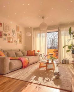 a living room filled with furniture and lots of windows