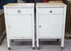 two white cabinets sitting next to each other