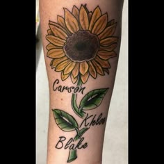 a sunflower with words written on it is shown in this tattoo artist's photo