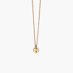 Wear our tiny initial necklace when subtlety is called for. Stamp an initial at the center of the disc and add additional pendants to spell out a name with multiple pendants. We've given the 5mm wide mini pendant a hammered finish for a rich look. Pendant hangs from our signature fine cable chain. Perfect for creating a layered look! Made of genuine 14k gold filled metal or sterling silver. | SPECIFICATIONS | Pendant size: 5mm wide. Font size: 1.6mm Metal: 14k gold filled / sterling silver. | Ca Simple Yellow Gold Initial Pendant Charm Necklace, Minimalist Personalized Charm Necklaces In Recycled Gold, Minimalist Personalized Charm Necklace In Recycled Gold, Gold Initial Necklace With Round Pendant For Everyday, Minimalist Gold Charm Necklaces With Initial Pendant, Everyday Tiny Charm Necklaces In 14k Gold Filled, Everyday Tiny Charm Necklace In 14k Gold Filled, Tiny Gold Round Pendant Necklace, Gold Tiny Round Pendant Necklace