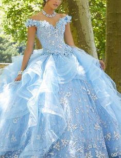 This Vizcaya prom dress showcases a sweetheart neckline and off the shoulder straps. The corset bodice is adjustable for the perfect fit. Ruffles overlay the tulle skirt giving it that fullness you desire. Shimmers of glitter appliques peek through the dress from head to toe. #promdresses2021 #promdresses #promdress #prom Off Shoulder V Neck, Quincenera Dresses, Blue Sweet 16, Quinceñera Dresses, Blue Quince, Quinceanera Dresses Blue, Pretty Quinceanera Dresses, Quince Dress, Quince Ideas