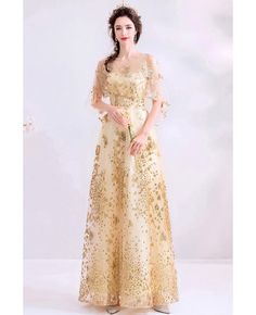 Buy Sparkly Bling Gold Long Party Dress With Sheer Neck Puffy Sleeves at wholesale price online. Free shipping and pro custom service since 2009. Champagne A-line Gown For Party, Spring Formal Gold Gown, Spring Wedding Gold Gown, Gold Gown For Party In Spring Season, Gold Gown For Party In Spring, Gold Dress For Holiday Banquet, Gold Holiday Dress For Banquets, Gold Holiday Dress For Banquet, Spring Champagne Evening Dress For Prom