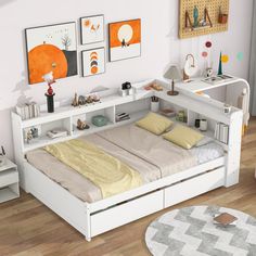 a white bed sitting in a bedroom on top of a hard wood floored floor