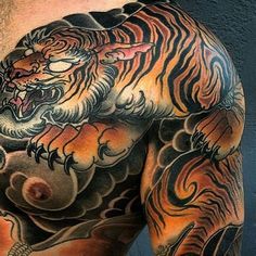 a man with a tiger tattoo on his chest