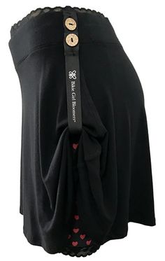 a woman's black skirt with red hearts on it