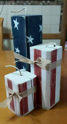 two small boxes decorated like the american flag are tied with twine and sitting on a table