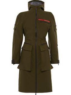 Are you after a power look? Prada introduces this khaki green military jacket, crafted from a technical fabric and boasting utilitarian elements such as flat pockets at the front, sleeves and back and a drawstring waist. Ready for anything life throws at you! Featuring a hood, a high standing collar, a front zip fastening, long sleeves, flap pockets, a logo to the chest, a zipped chest pocket, a fitted waist and a mid-length. Prada Jacket, Military Jacket Green, Waterproof Jacket, Jacket Women, Khaki Green, Green Jacket, Military Green, Gore Tex, Size Clothing