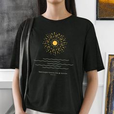 This Minimalist Sun and Waves Spiritual T-Shirt exudes a groovy boho vibe with its inspirational graphic design. Perfect for those seeking positive energy and faith-based quotes. Ideal for casual wear or as a statement piece in semi-formal settings. Relevant for individuals who are into spiritual and bohemian aesthetics, suitable for holidays like Easter or summer vacations. Elevate your wardrobe with this unique Minimalist Sun and Waves Spiritual T-Shirt! Featuring a radiant sunburst design paired with tranquil waves, this boho-inspired tee brings a sense of positivity and peace wherever you go. Whether you're dressing up for a casual day out or looking for a spiritual statement piece, this graphic shirt blends style and inspiration effortlessly. It's perfect for nature lovers, yoga enthu Inspirational Graphic Design, Based Quotes, Waves Design, Summer Vacations, Quote Tees, Boho Shirts, Boho Skirts, Complete Outfits