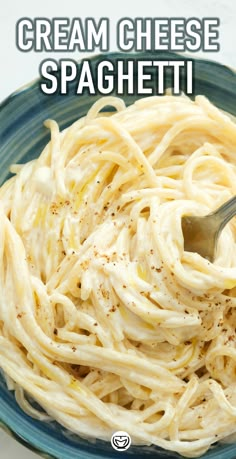 a blue bowl filled with cream cheese spaghetti