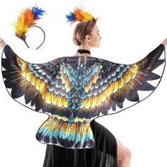 a woman wearing a colorful bird costume with feathers on her head and wings in the shape of an eagle