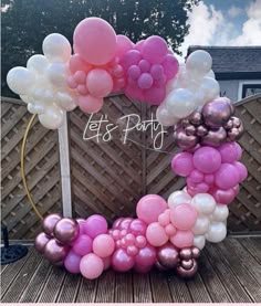 a bunch of balloons that are on top of a table